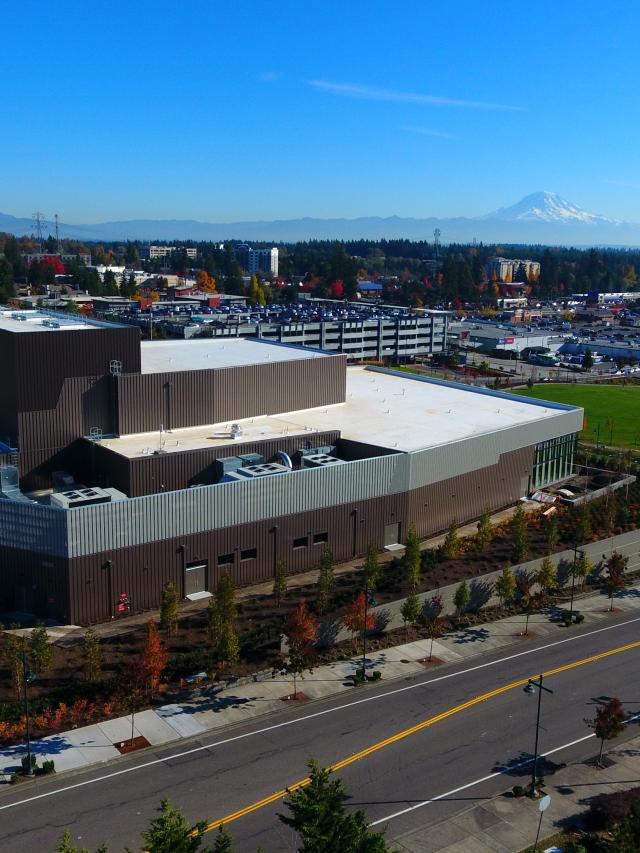 Drone image of the Performing Arts & Event Center looking South East over Town Square Park with Mt. Rainier in the background